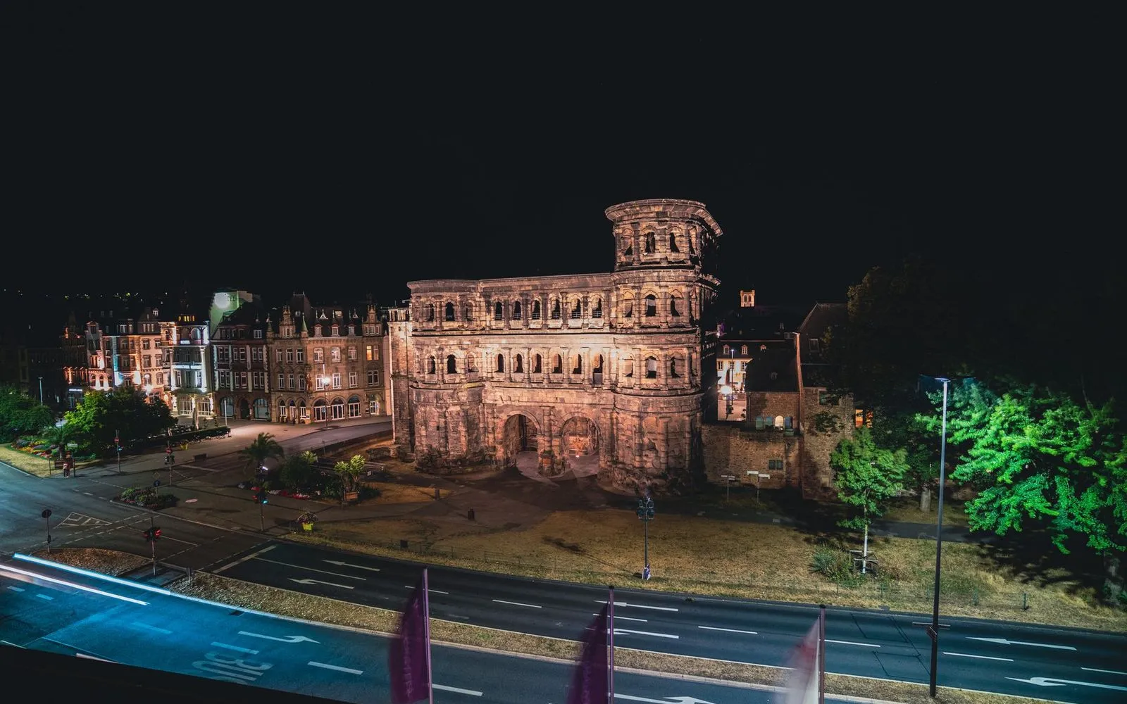 The illuminated ancient Roman gate, Porta Nigra, in Trier at night.